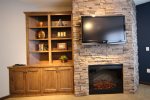 Stone electric fireplace w/Flat screen TV and built in